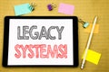 Word, writing Legacy Systems. Business concept for Upgrade SOA Application Written on tablet laptop, wooden background with sticky