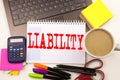 Word writing Liability in the office with laptop, marker, pen, stationery, coffee. Business concept for Accountability Legal Blam Royalty Free Stock Photo