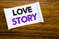 Word, writing Love Story. Business concept for Loving Someone Heart written on sticky note paper on the wooden wood structure vis Royalty Free Stock Photo