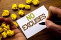 Word, writing No Excuses. Concept for Stop Ban for Excuse written on notebook note paper on the wooden background with folded pape Royalty Free Stock Photo