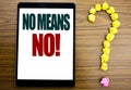 Word, writing No Means No. Business concept for Stop Anti Slogan Written on tablet, wooden background with question mark on t