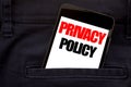 Word, writing Privacy Policy. Business concept for Safety Data Rules Written phone mobile phone, cellphone placed in the man front Royalty Free Stock Photo