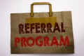 Word, writing Referral Program. Business concept for Refer Marketing Written on shopping bag, white background.