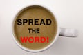 Word, writing Spread The Word text in coffee in cup Business concept for Announcement Business Marketing Message on white backgrou