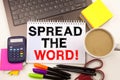 Word writing Spread The Word in the office with surroundings such as laptop marker pen stationery coffee Business concept for Anno