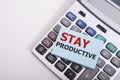 Word writing Stay Productive in the office on calculator Business concept for Concentration Efficiency Productivity Workshop Royalty Free Stock Photo