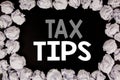 Word, writing Tax Tips. Business concept for Taxpayer Assistance Refund Reimbursement written on black background with copy space Royalty Free Stock Photo