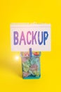Word writing text Backup. Business concept for copy of file or other item data made in case original is lost damaged Trash bin