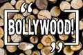 Word writing text Bollywood. Business concept for Indian cinema a source of entertainment among new generation Wooden background