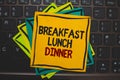 Word writing text Breakfast Lunch Dinner. Business concept for eating your meals at different period of day Multiple colour sticky