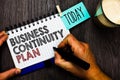 Word writing text Business Continuity Plan. Business concept for creating systems prevention deal potential threats Man holding ma Royalty Free Stock Photo