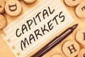 Word writing text Capital Markets. Business concept for Allow businesses to raise funds by providing market security