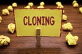 Word writing text Cloning. Business concept for Make identical copies of someone or something Creating clones Clothespin holding y