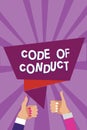Word writing text Code Of Conduct. Business concept for Ethics rules moral codes ethical principles values respect Man woman hands Royalty Free Stock Photo