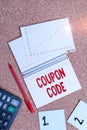Word writing text Coupon Code. Business concept for ticket or document that can be redeemed for a financial discount Desk notebook