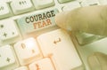 Word writing text Courage Fear. Business concept for quality of mind that enables a demonstrating to face difficulty