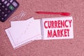 Word writing text Currency Market. Business concept for over the counter market for the trading of currencies Desk notebook paper