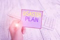 Word writing text Disaster Plan. Business concept for outlines how an organization responds to an unplanned event man holding Royalty Free Stock Photo
