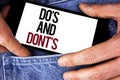 Word writing text Do'S And Don'Ts. Business concept for What can be done and what cannot be knowing right wrong written on Mobil Royalty Free Stock Photo