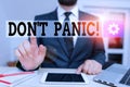 Word writing text Don T Panic. Business concept for suddenly feel so worried or frightened that you can not behave Male human wear Royalty Free Stock Photo