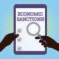 Word writing text Economic Sanctions. Business concept for Penalty Punishment levied on another country Trade war Hands