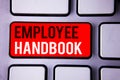 Word writing text Employee Handbook. Business concept for Document Manual Regulations Rules Guidebook Policy Code White Text two w Royalty Free Stock Photo