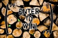 Word writing text Enter To Win. Business concept for Sweepstakes Trying the luck to earn the big prize Lottery Wooden background