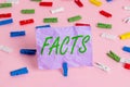 Word writing text Facts. Business concept for information used as evidence or part of report news article blog Colored clothespin