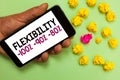 Word writing text Flexibility 100 90 80. Business concept for How much flexible you are maleability level Man holding cell phone w Royalty Free Stock Photo