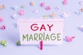 Word writing text Gay Marriage. Business concept for entered into in a civil or religious ceremony of the same sex Colored