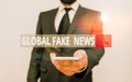 Word writing text Global Fake News. Business concept for False information Journalism Lies Disinformation Hoax Male Royalty Free Stock Photo