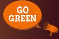 Word writing text Go Green. Business concept for pursue a more environmentfriendly lifestyle and decision Megaphone make