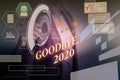 Word writing text Goodbye 2020. Business concept for New Year Eve Milestone Last Month Celebration Transition Woman wear Royalty Free Stock Photo