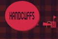 Word writing text Handcuffs. Business concept for Pair of lockable linked metal rings for securing a prisoner