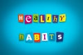 A word writing text - healthy habits - from cut letters on a blue background. Headline, card, banner with inscription. Psychologic Royalty Free Stock Photo