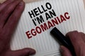 Word writing text Hello I am An Egomaniac. Business concept for Selfish Egocentric Narcissist Self-centered Ego Man's hand grasp