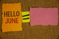 Word writing text Hello June. Business concept for Starting a new month message May is over Summer startingIdeas created on orange