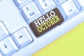 Word writing text Hello October. Business concept for Last Quarter Tenth Month 30days Season Greeting White pc keyboard Royalty Free Stock Photo