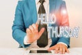 Word writing text Hello Thursday. Business concept for the greeting used to welcome the day after wednesday Businessman with Royalty Free Stock Photo
