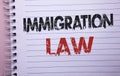 Word writing text Immigration Law. Business concept for National Regulations for immigrants Deportation rules written on Notebook