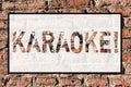 Word writing text Karaoke. Business concept for Entertainment singing along instrumental music played by a machine Brick Royalty Free Stock Photo