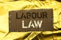 Word writing text Labour Law. Business concept for Employment Rules Worker Rights Obligations Legislation Union written on tear Ca