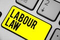 Word writing text Labour Law. Business concept for Rules implemented by the state between employers and employee Keyboard yellow k