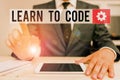 Word writing text Learn To Code. Business concept for Learn to write Software Be a Computer Programmer Coder Male human Royalty Free Stock Photo