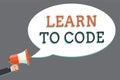 Word writing text Learn To Code. Business concept for Learn to write Software Be a Computer Programmer Coder Man holding megaphone Royalty Free Stock Photo