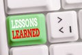 Word writing text Lessons Learned. Business concept for the knowledge or understanding gained by experience White pc Royalty Free Stock Photo