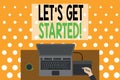 Word writing text Let S Get Started. Business concept for encouraging someone to begin doing something Upper view laptop wooden