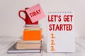 Word writing text Let S Is Get Started. Business concept for to begin doing or working on something you had started Cup