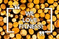 Word writing text We Love Fitness. Business concept for Having affection for sport exercises good healthy diet Wooden