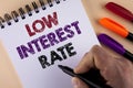 Word writing text Low Interest Rate. Business concept for Manage money wisely pay lesser rates save higher written by Man with Mar Royalty Free Stock Photo